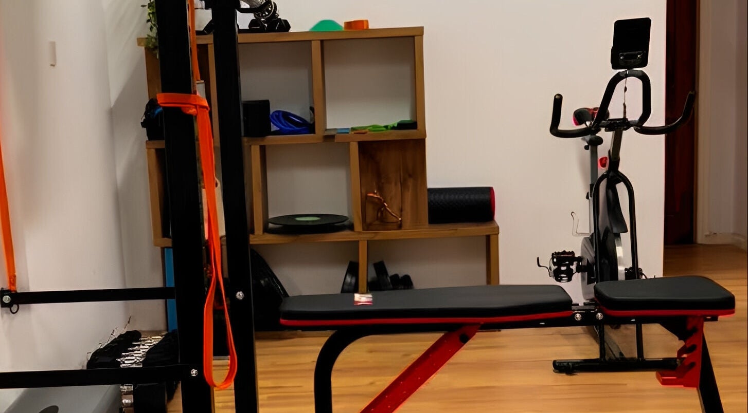 Theramotion Physiotherapy gym setup in Λευκωσία, Λευκωσία, CY with bench, bike, and equipment.