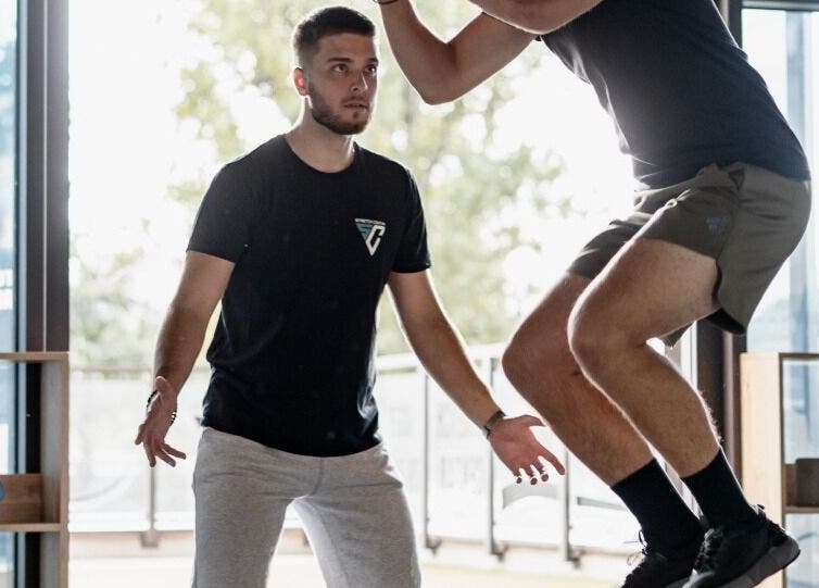 Trainer guiding fitness jump at Stretch Centar Beograd, Beograd, RS.