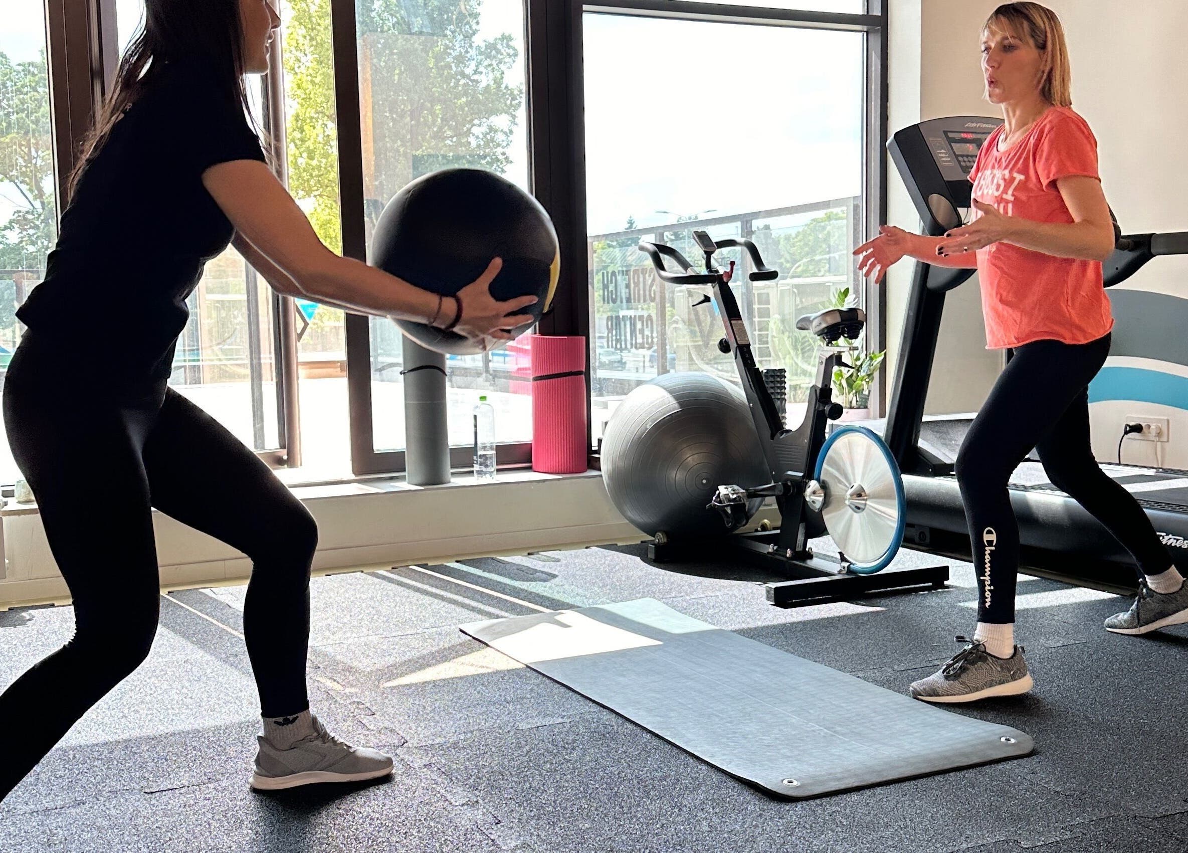 Two people exercising with fitness ball at Stretch Centar Beograd, Beograd, RS.