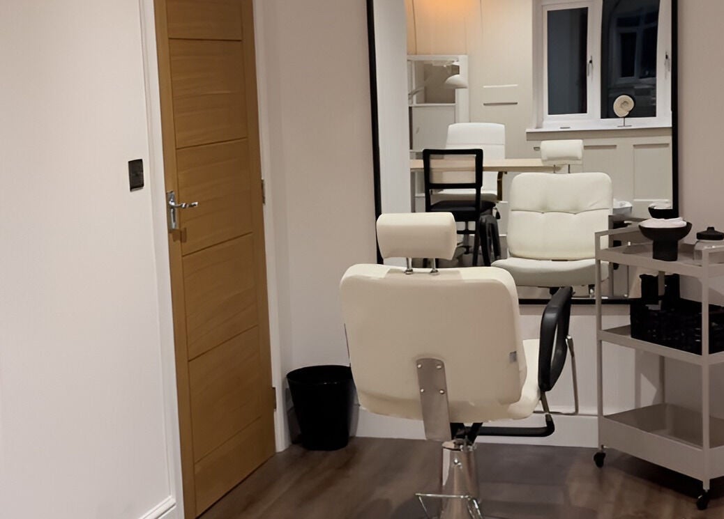 Modern salon chair in ByChloeAllen, Tamworth, England, GB, with elegant decor and large mirror.