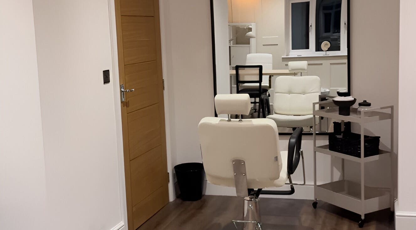 Modern salon chair in ByChloeAllen, Tamworth, England, GB, with elegant decor and large mirror.