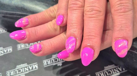 Bright pink manicured nails at The Beauty Retreat, Eastbourne, England, GB, showcasing elegant nail art.