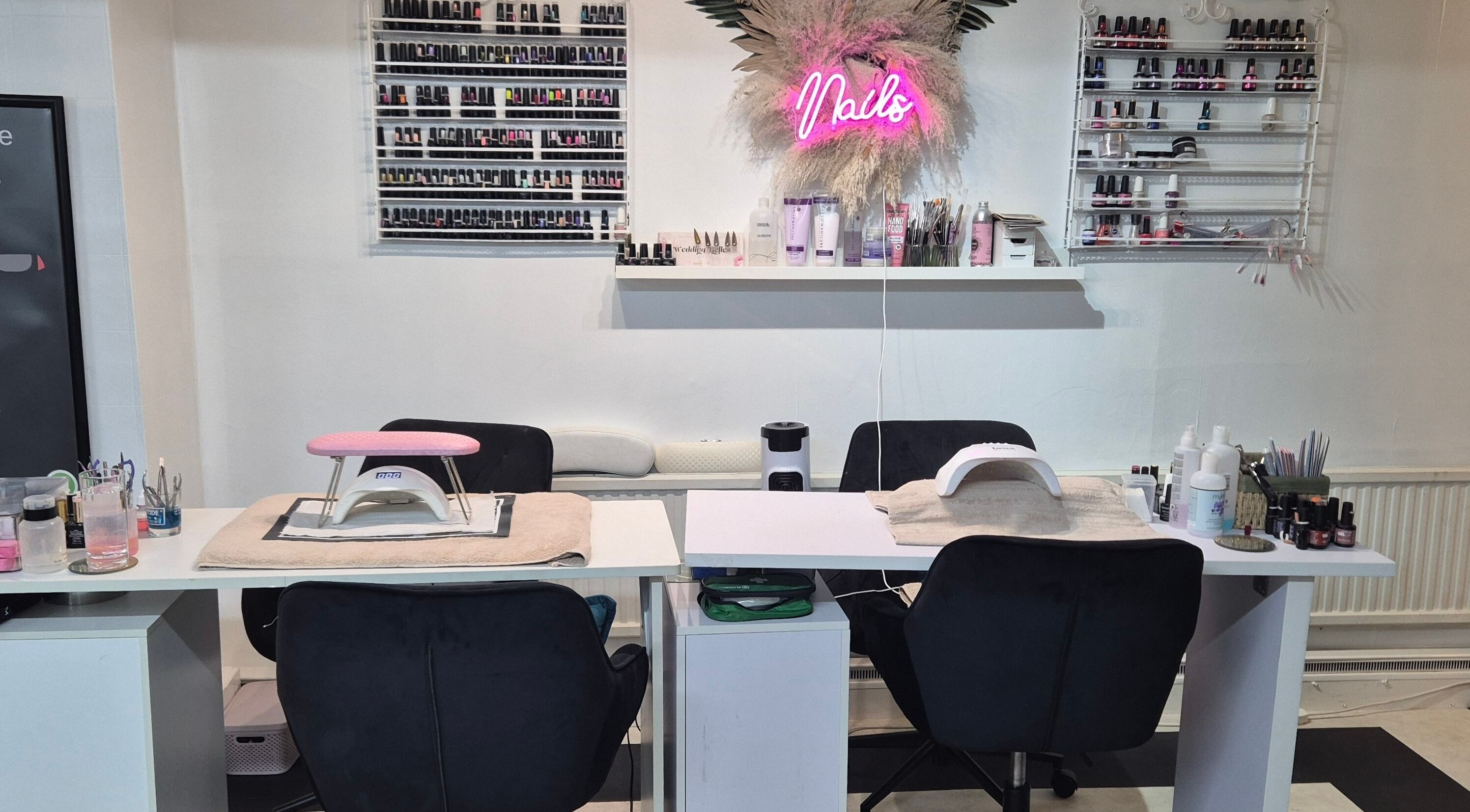 Nail care station at The Beauty Retreat, Eastbourne, England, GB, featuring vibrant polish displays.