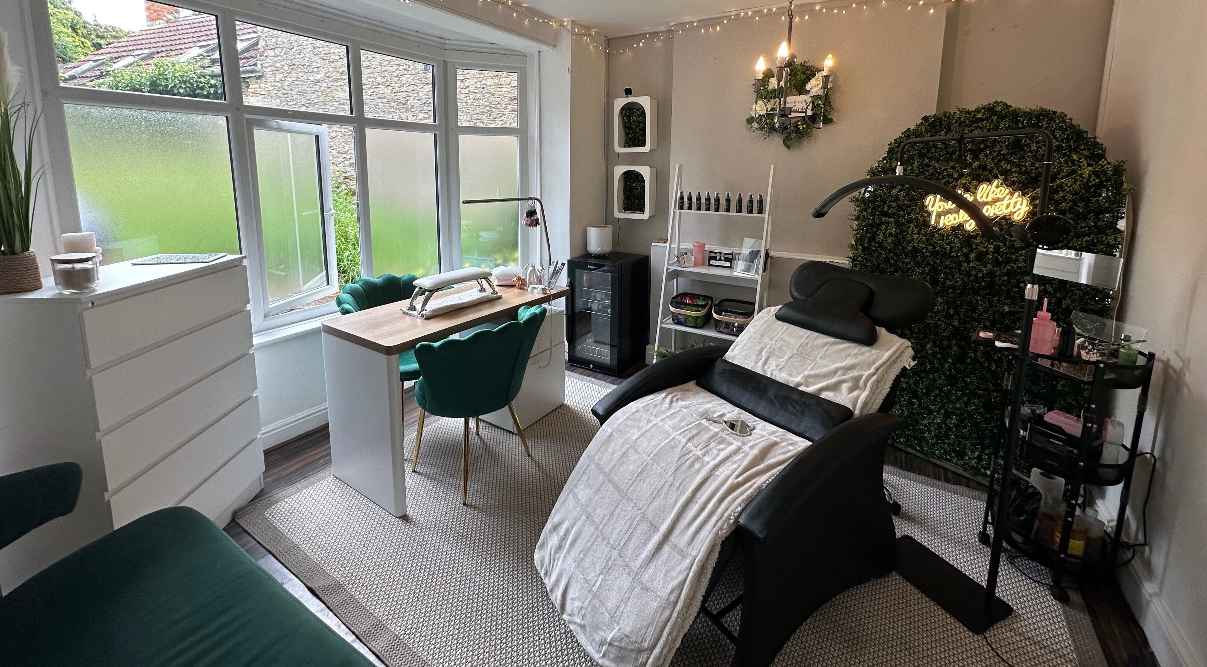 Chic beauty room at Ellis & Co Beauty, Irchester, England, GB, with elegant decor and plush seating.