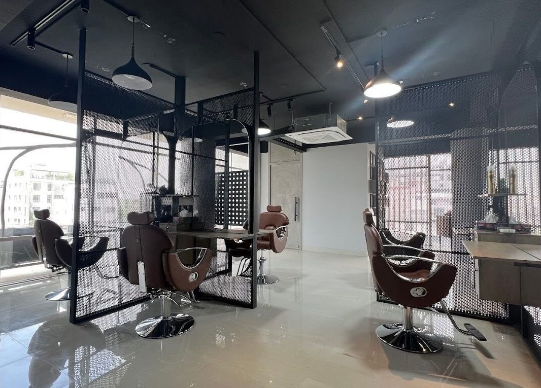 Sleek interior of The Original Groomers in Dhaka, Dhaka Division, BD with stylish barber chairs and modern decor.