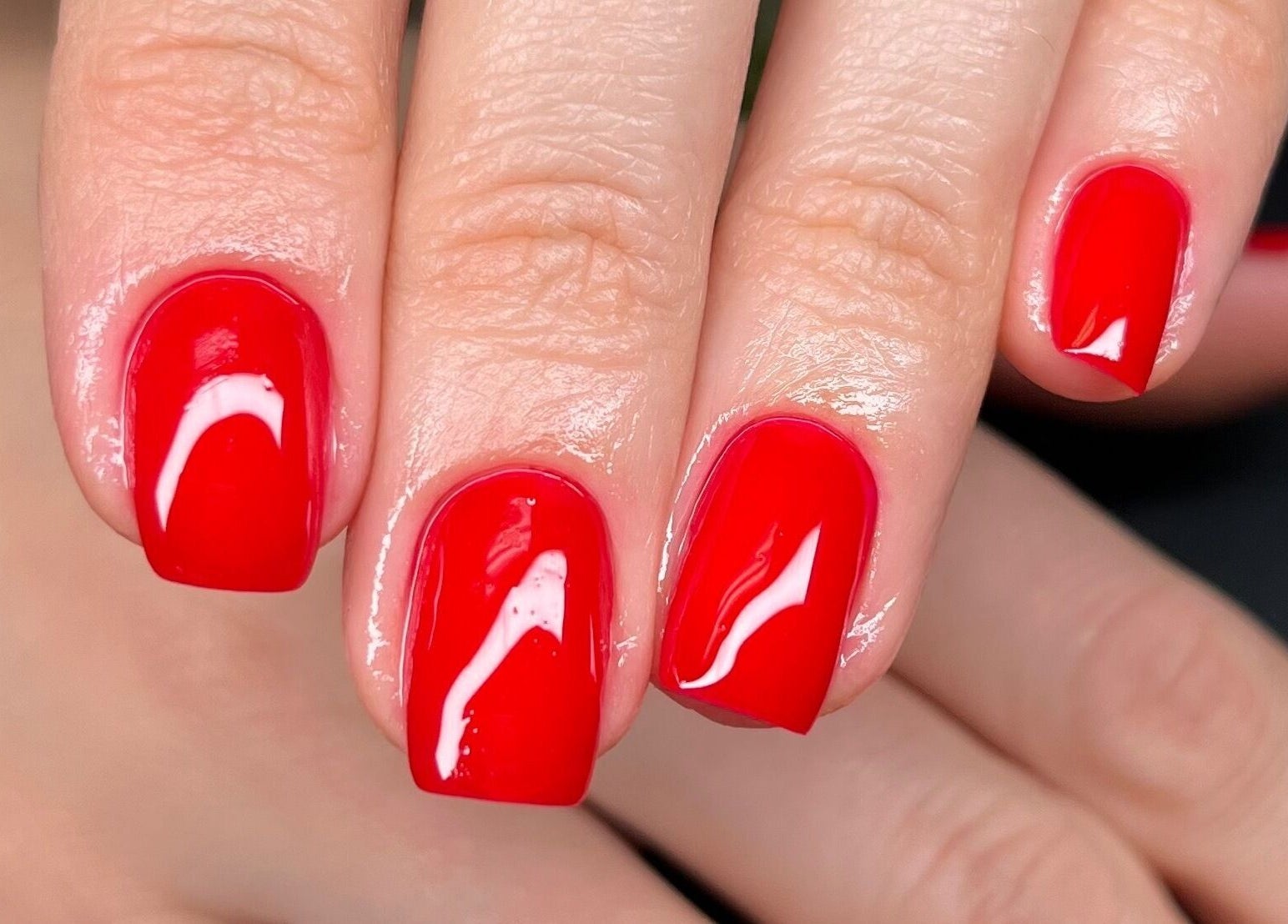 Vibrant red manicure at Studio Monarch by Leia Ebert, Bundall, Queensland, AU.