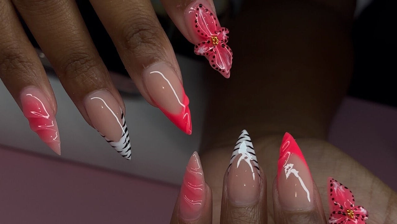Elegant nail art with pink and zebra patterns at Brushed by Jay D, Tallahassee, Florida, US.