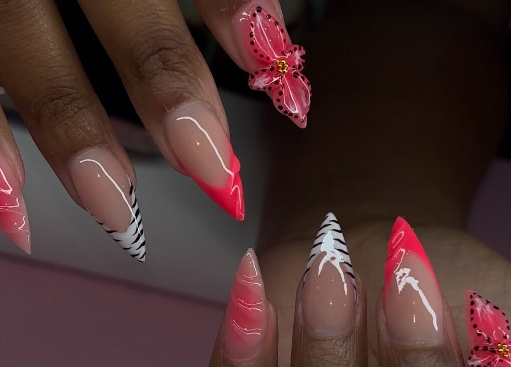 Elegant nail art with pink and zebra patterns at Brushed by Jay D, Tallahassee, Florida, US.