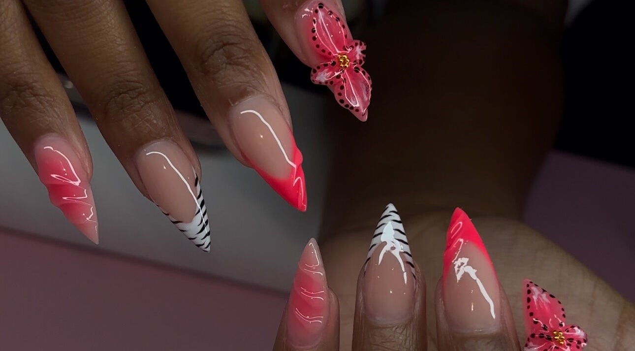 Elegant nail art with pink and zebra patterns at Brushed by Jay D, Tallahassee, Florida, US.