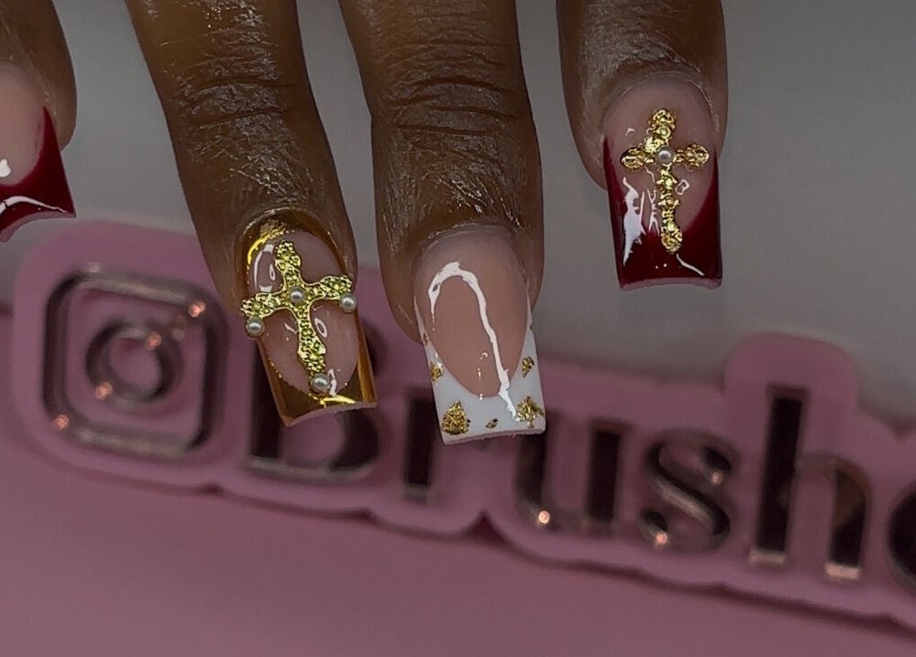 Elegant nail art with gold crosses by Brushed by Jay D in Tallahassee, Florida, US.