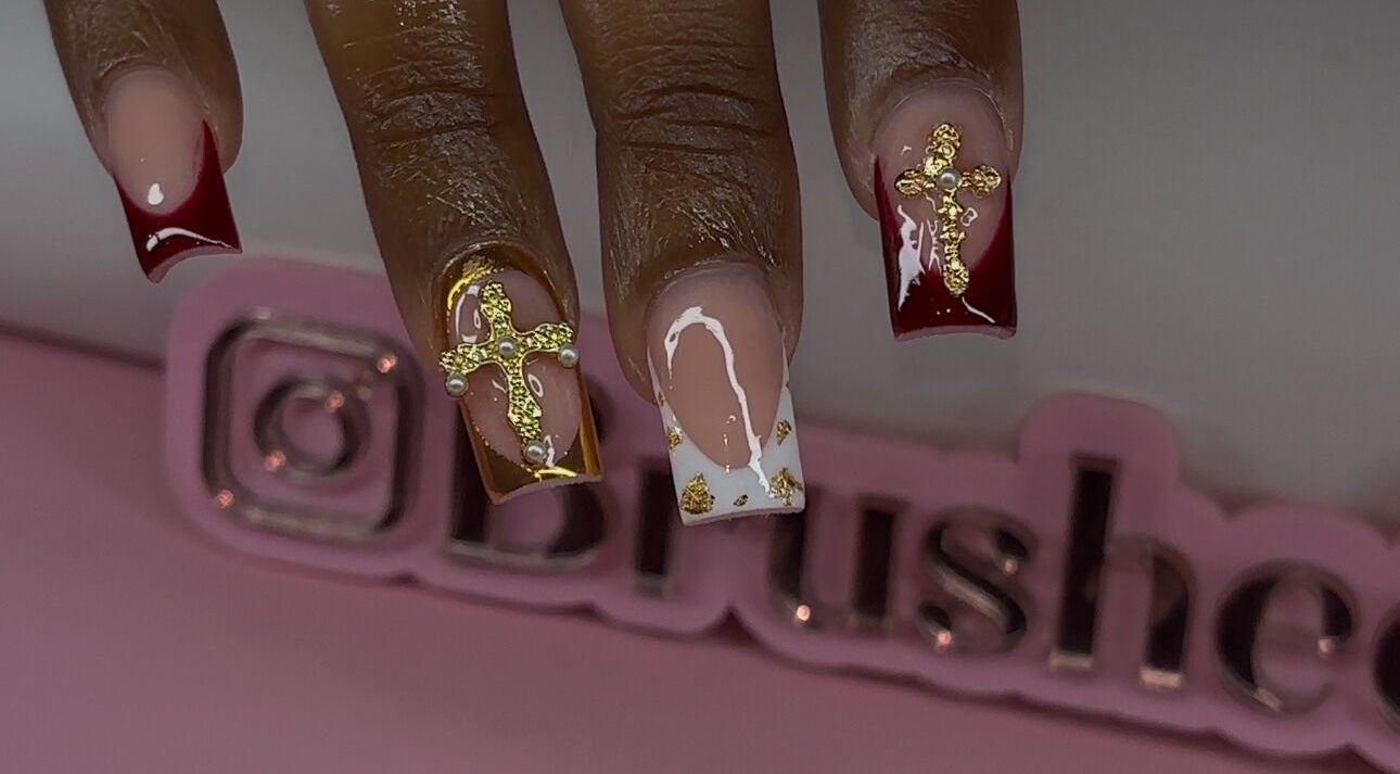 Elegant nail art with gold crosses by Brushed by Jay D in Tallahassee, Florida, US.
