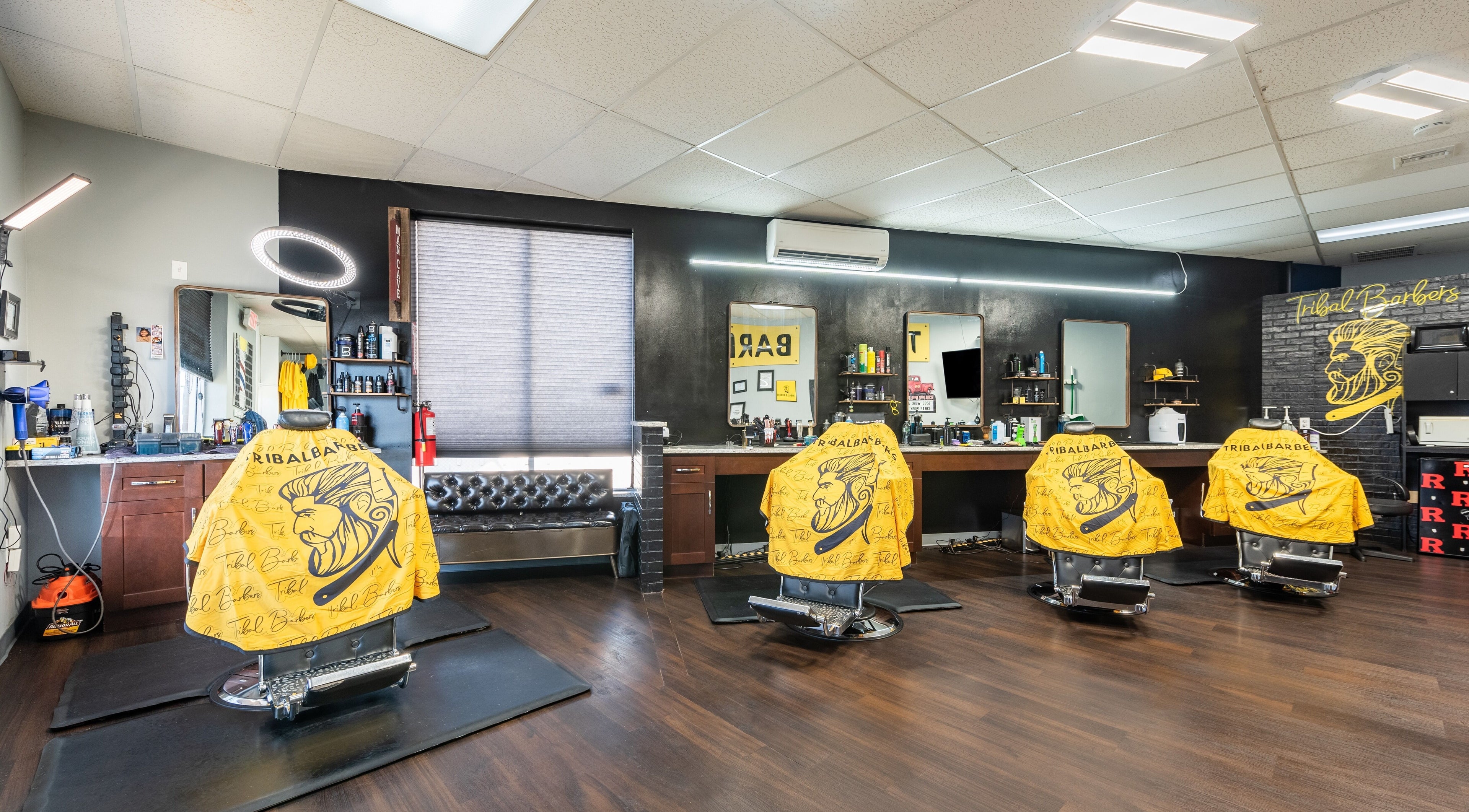 Spacious interior of Tribal Barbers South River in South River, New Jersey, US, featuring stylish barber chairs.