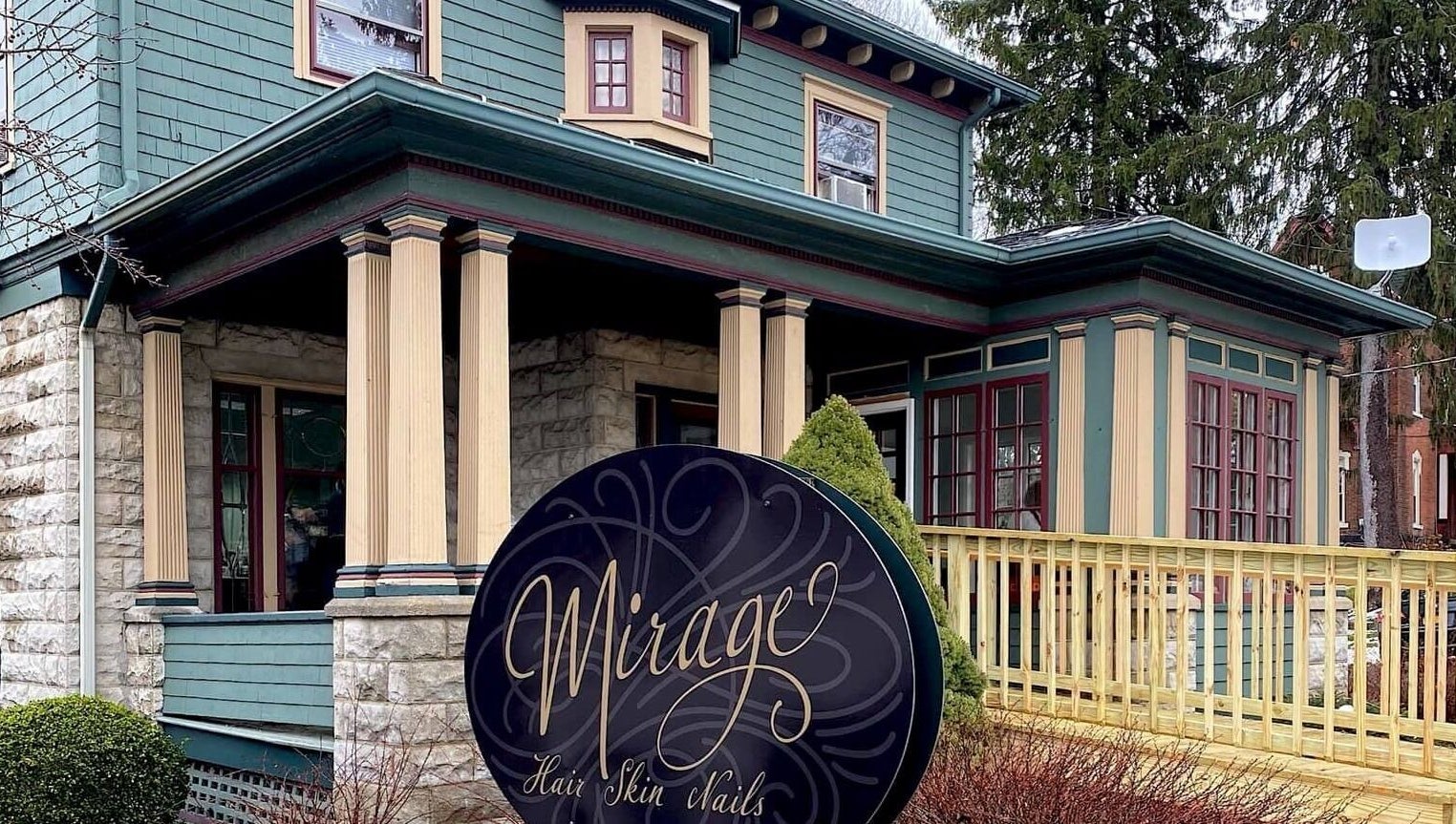 Charming facade of Mirage Salon in Jamestown, New York, US, showcasing elegant architecture with a welcoming entrance.