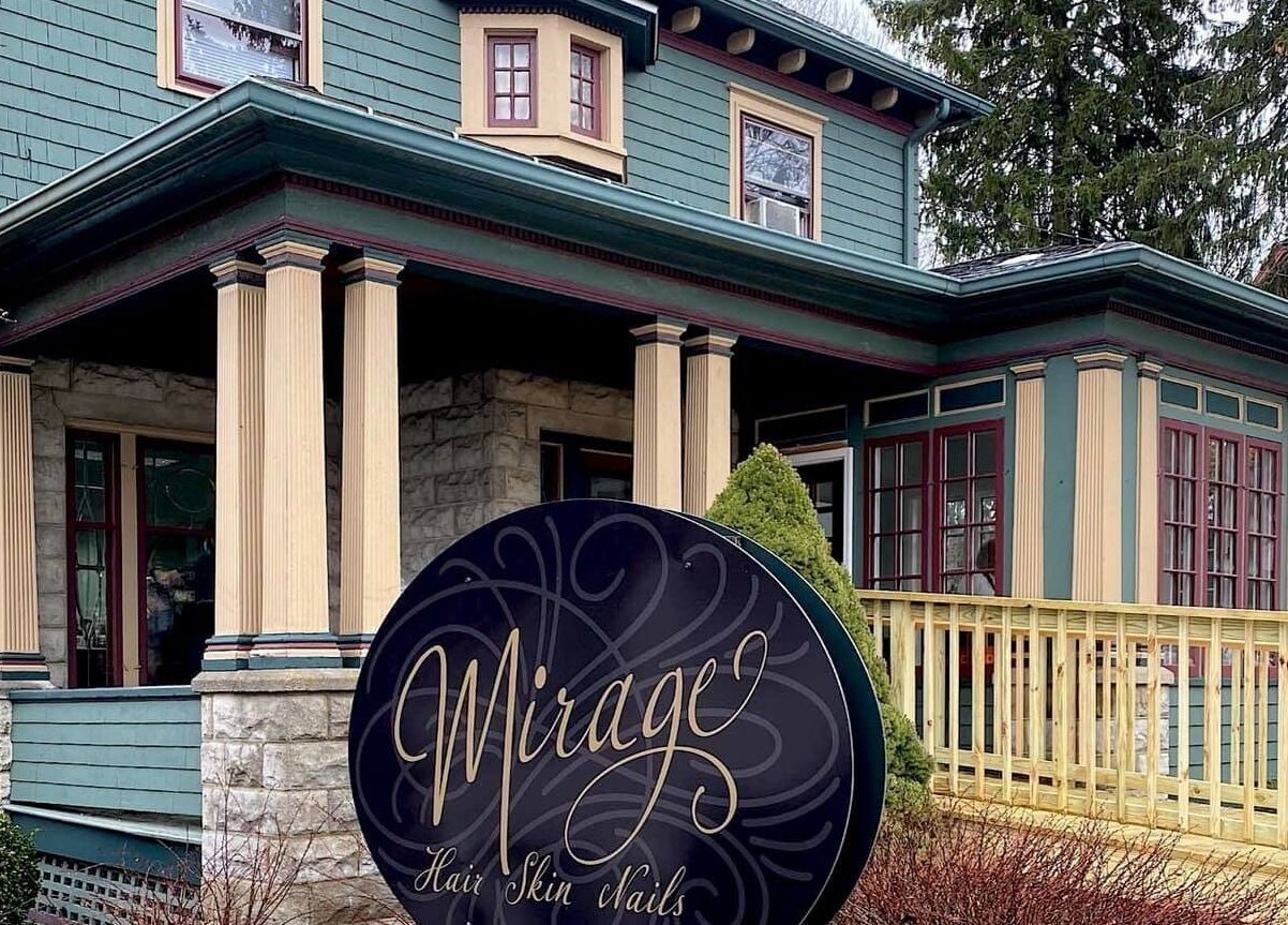 Charming facade of Mirage Salon in Jamestown, New York, US, showcasing elegant architecture with a welcoming entrance.