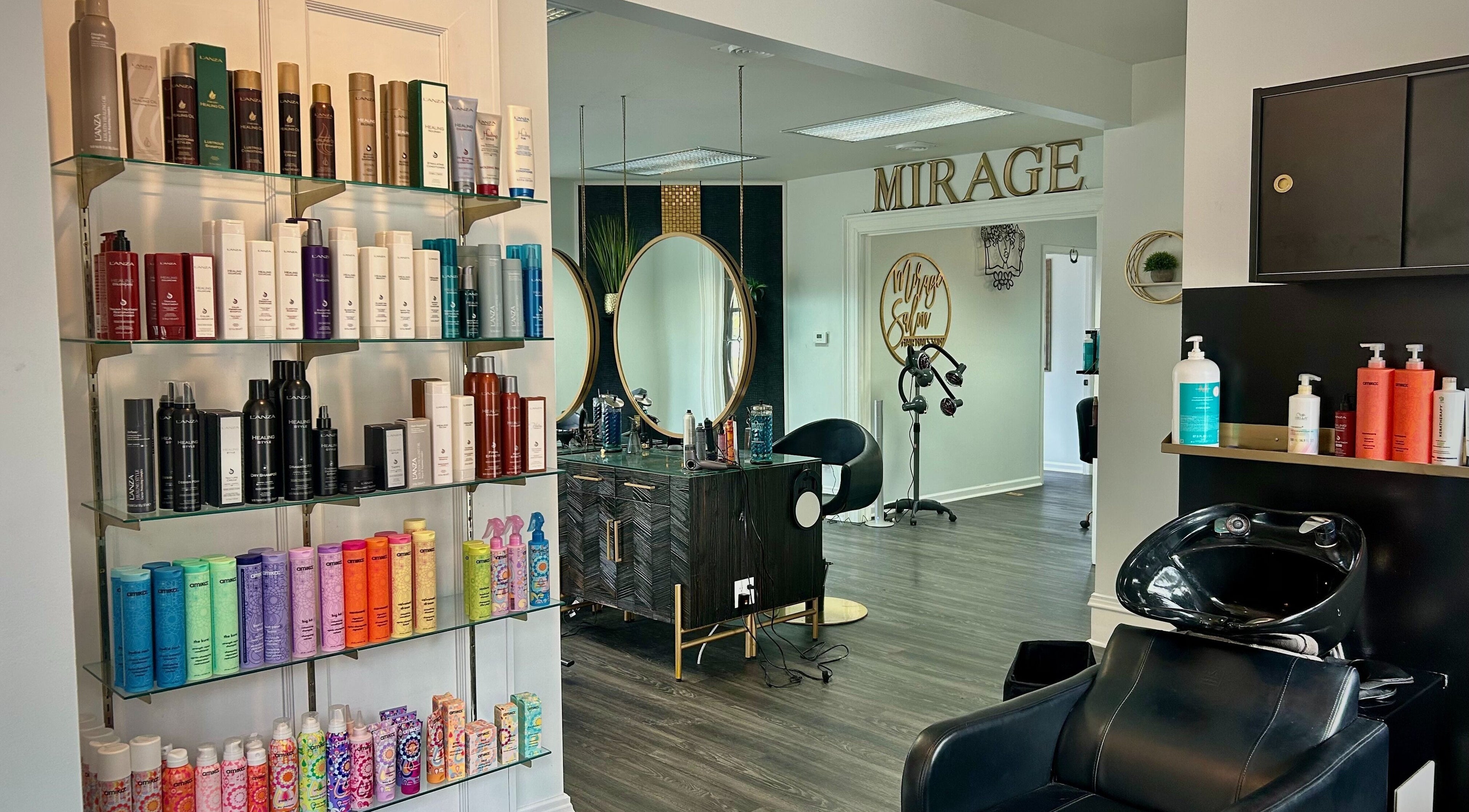 Interior of Mirage Salon in Jamestown, New York, US with hair products and styling stations.
