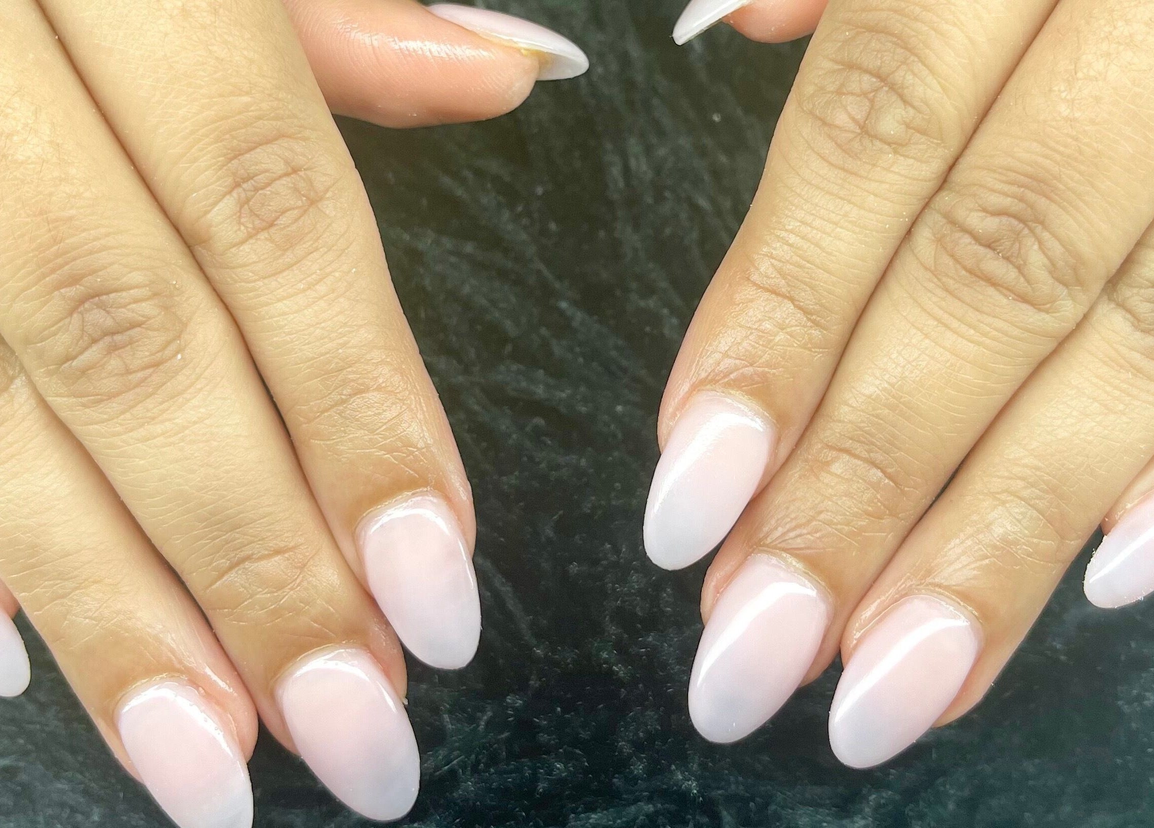 Well-manicured hands featuring elegant nails at Studio by Jess, Vancouver, British Columbia, CA.