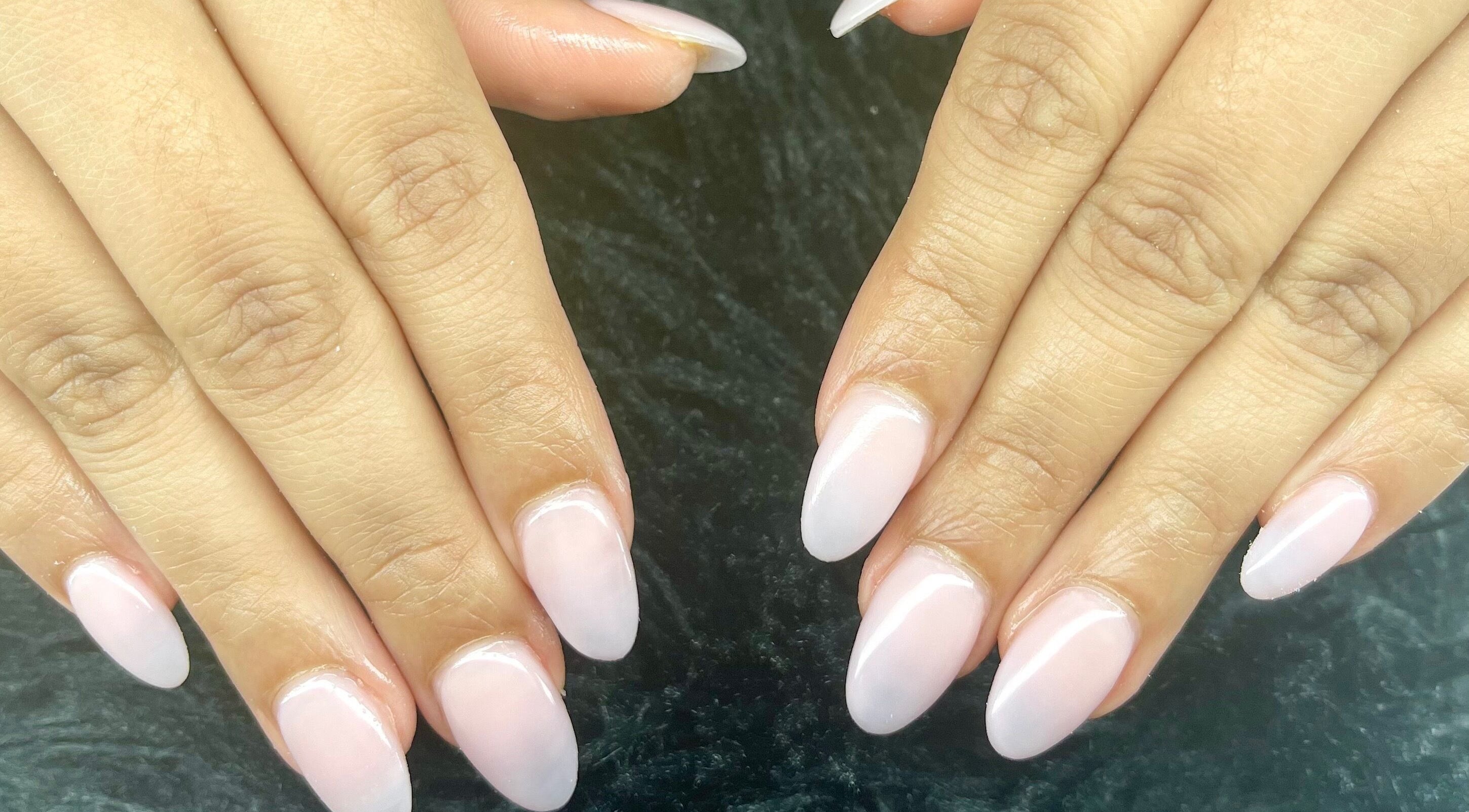 Well-manicured hands featuring elegant nails at Studio by Jess, Vancouver, British Columbia, CA.