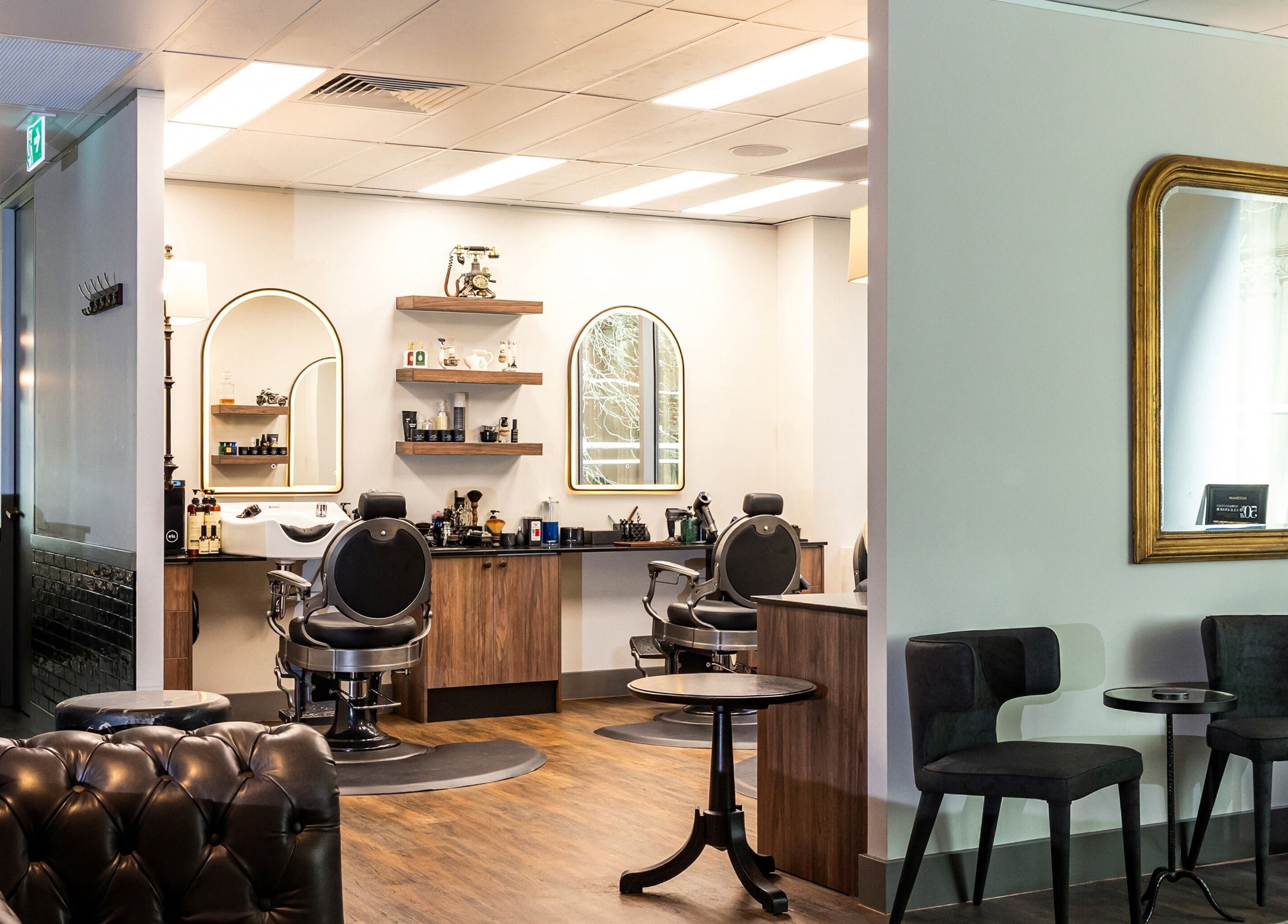 Chic interior of True Cut Barber Studio in Sydney, New South Wales, AU. Stylish seating and grooming stations.