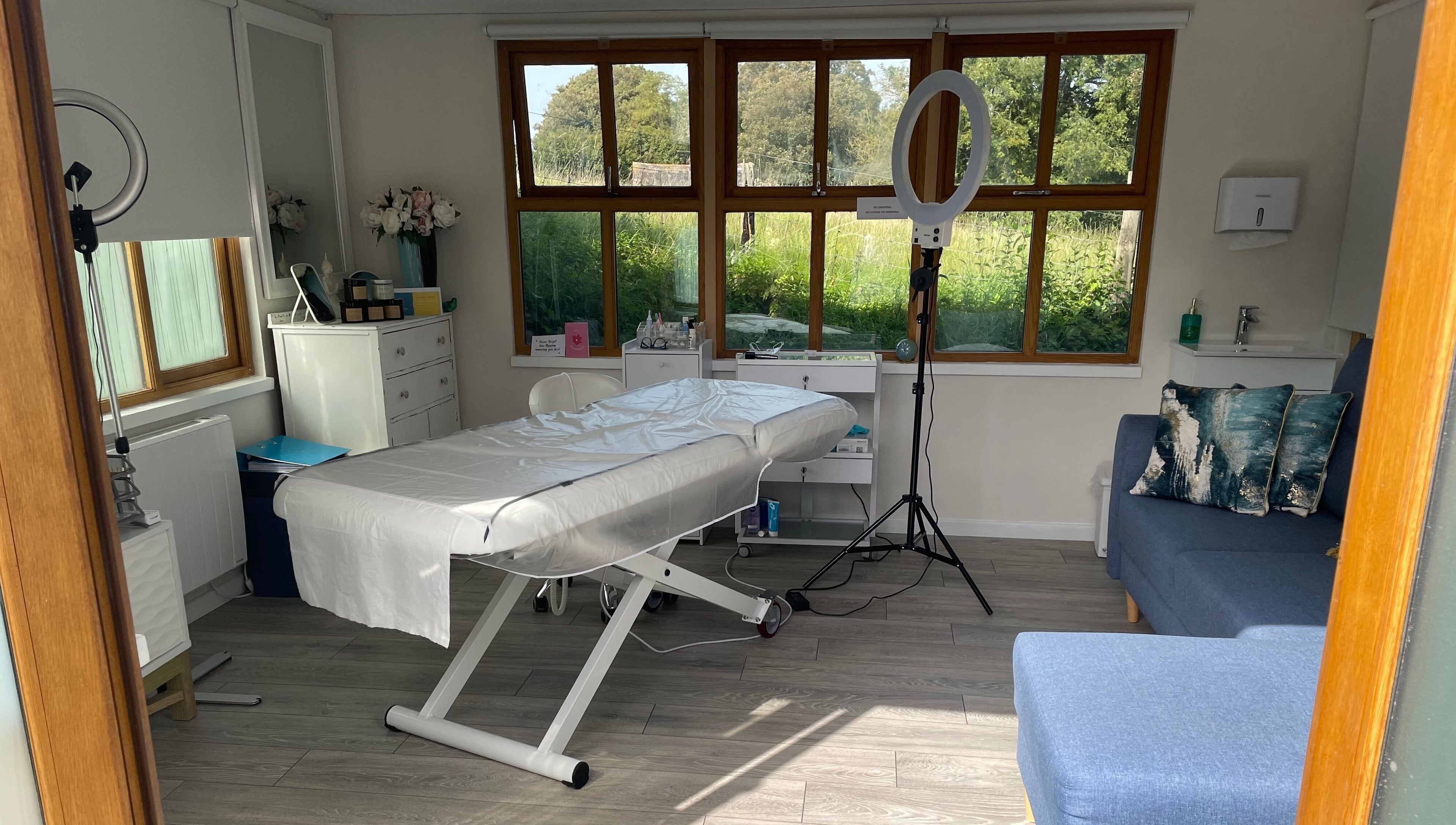 Calm treatment room at Rachael Loco Permanent Makeup in Dorchester, England, GB, with a comfortable bed.