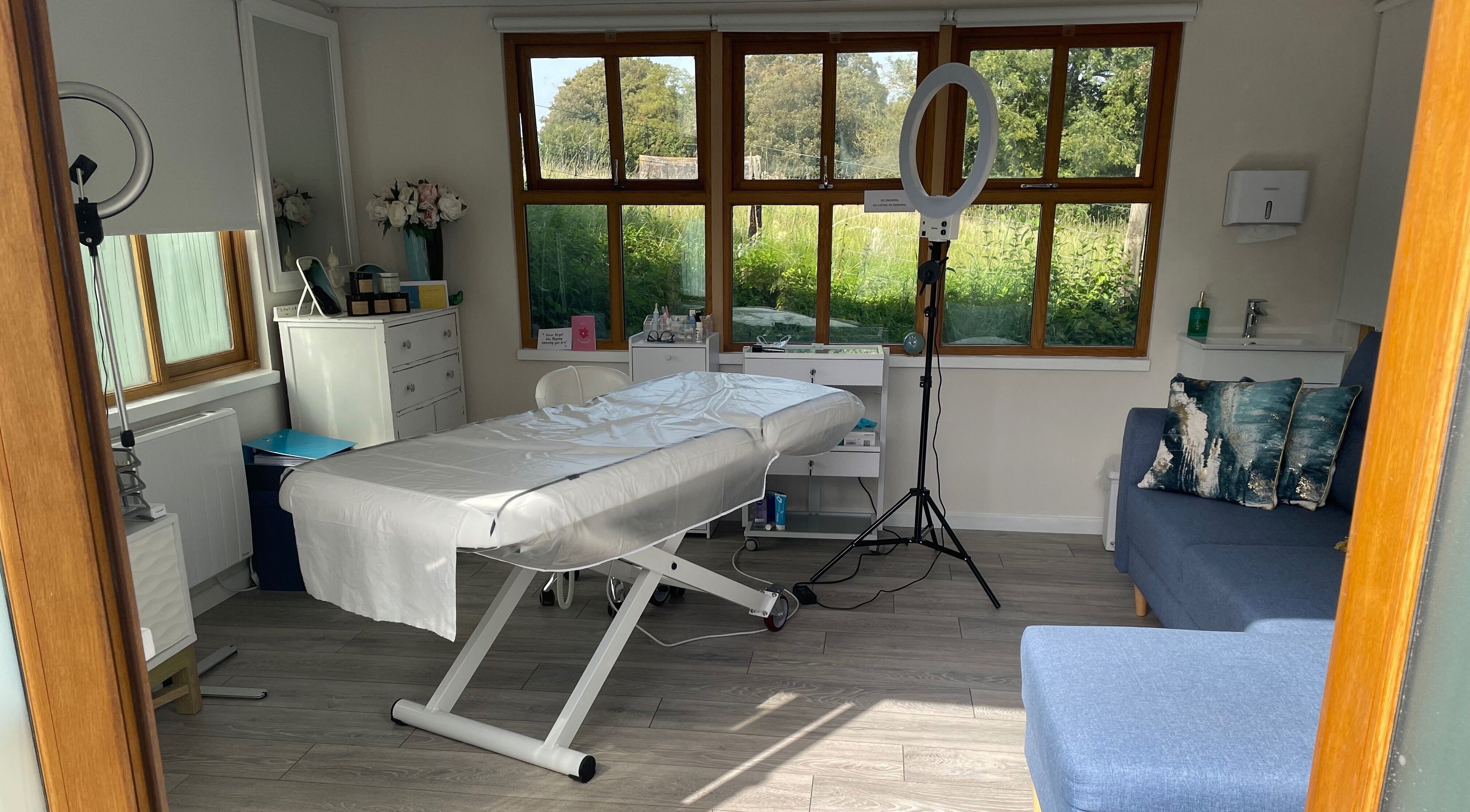 Calm treatment room at Rachael Loco Permanent Makeup in Dorchester, England, GB, with a comfortable bed.