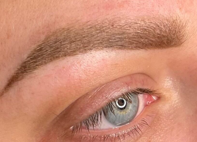 Close-up of expertly shaped eyebrow by Rachael Loco Permanent Makeup in Dorchester, England, GB.