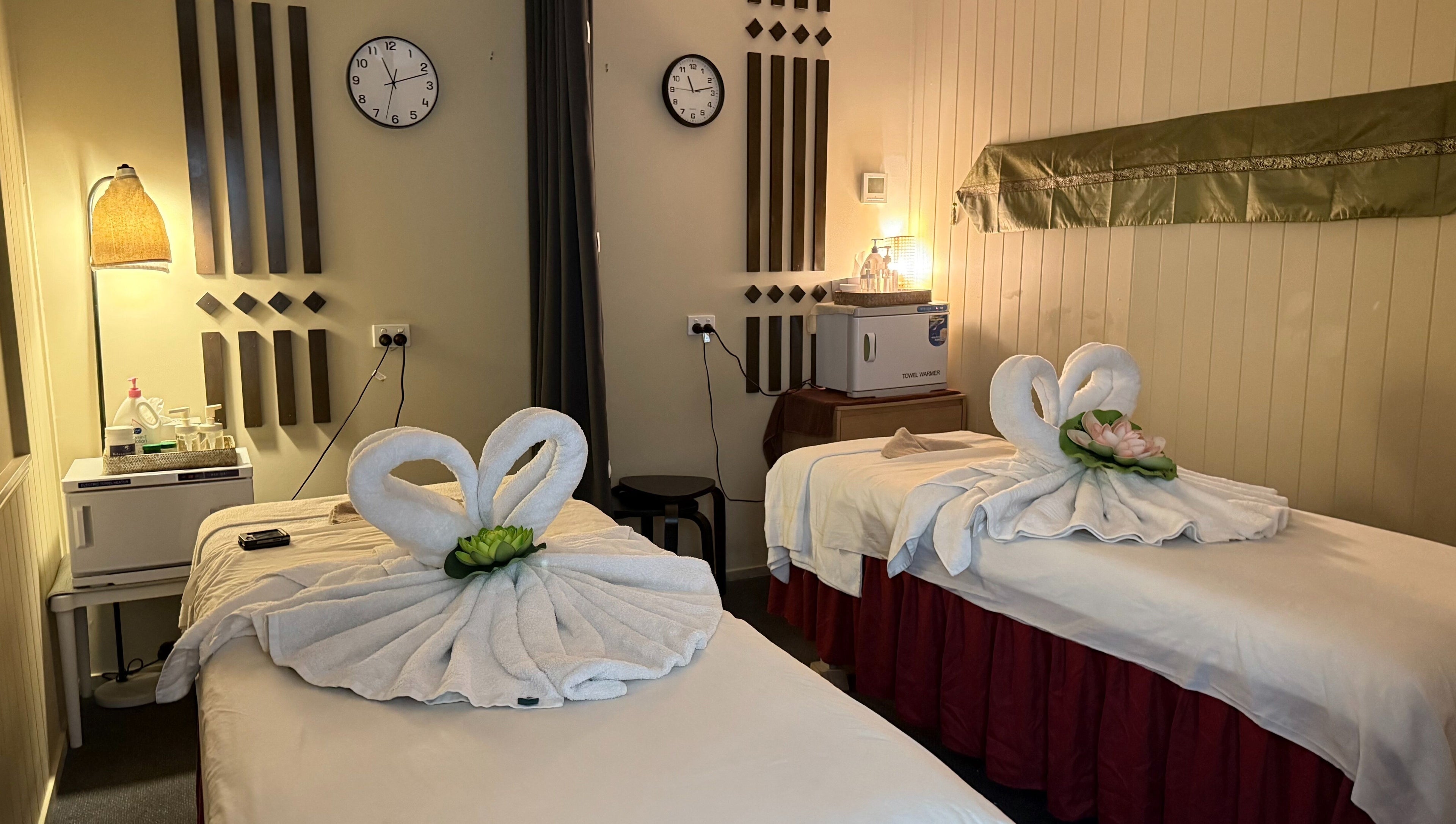 Calming twin massage beds at Ploythai Massage and Spa, Wynnum, Queensland, AU with elegant towel swans.