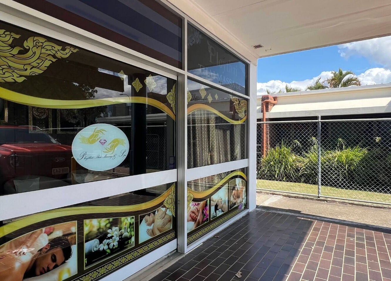 Entrance of Ploythai Massage and Spa, featuring decorative windows, located in Wynnum, Queensland, AU.