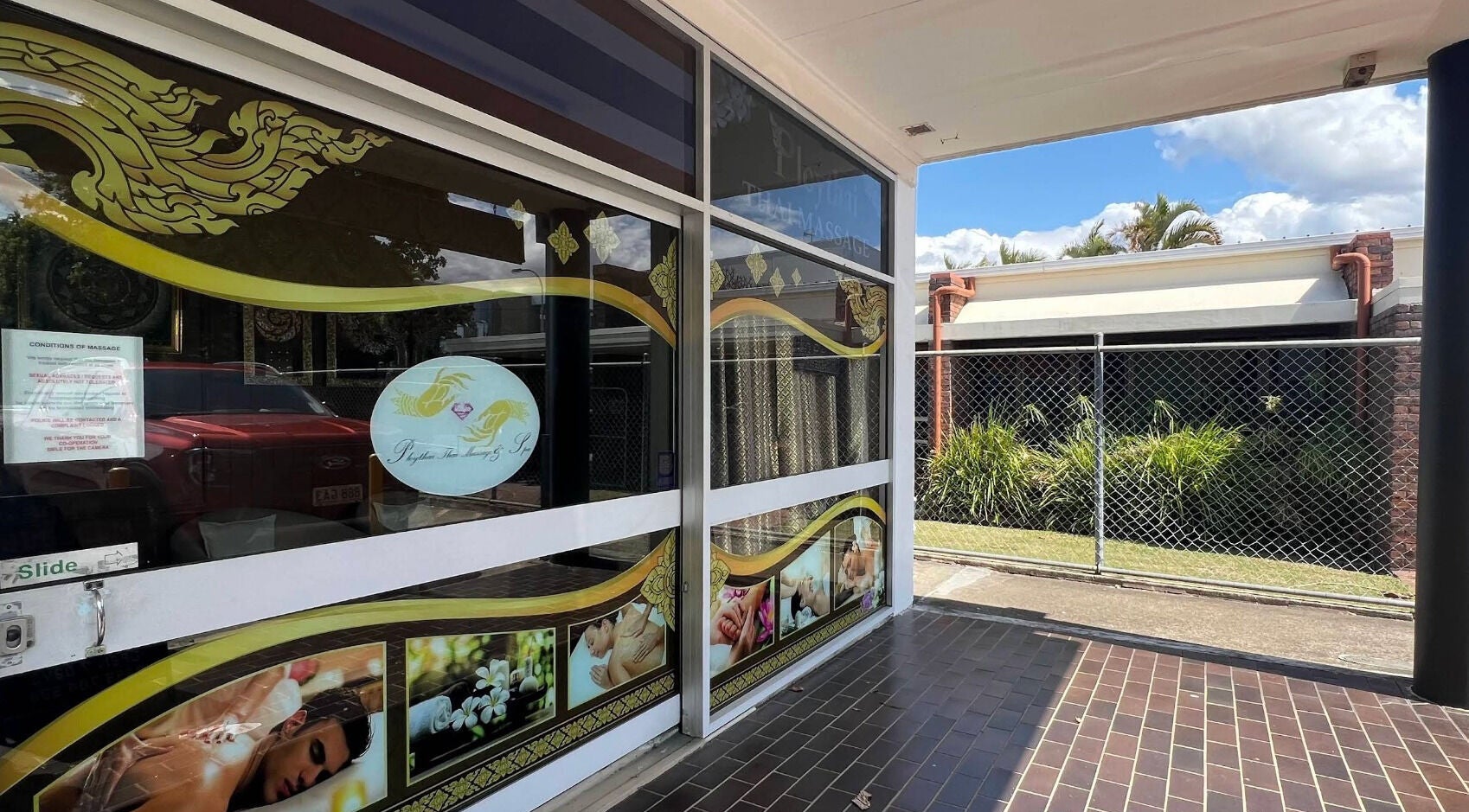 Entrance of Ploythai Massage and Spa, featuring decorative windows, located in Wynnum, Queensland, AU.