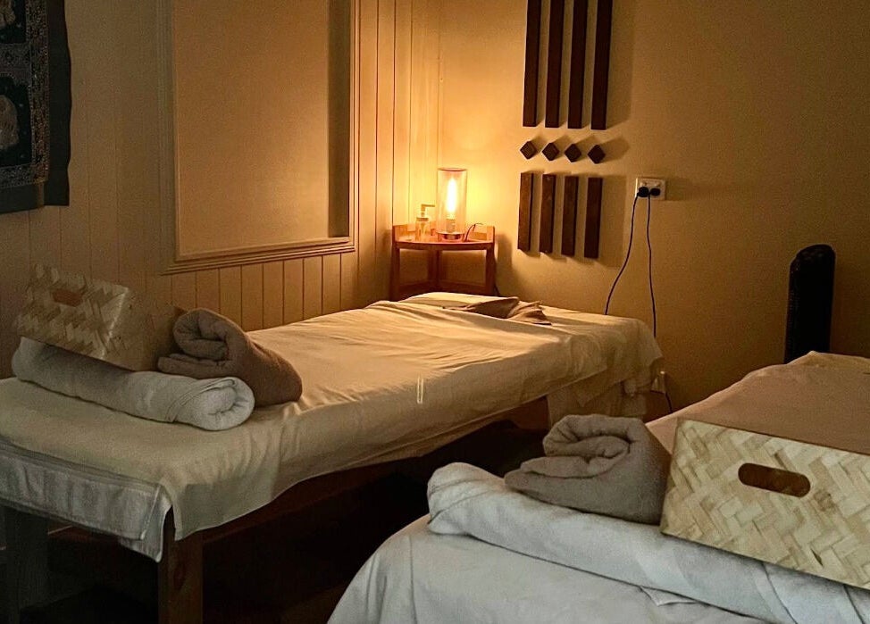 Cozy massage room at Ploythai Massage and Spa, Wynnum, Queensland, AU with elegant decor and ambient lighting.
