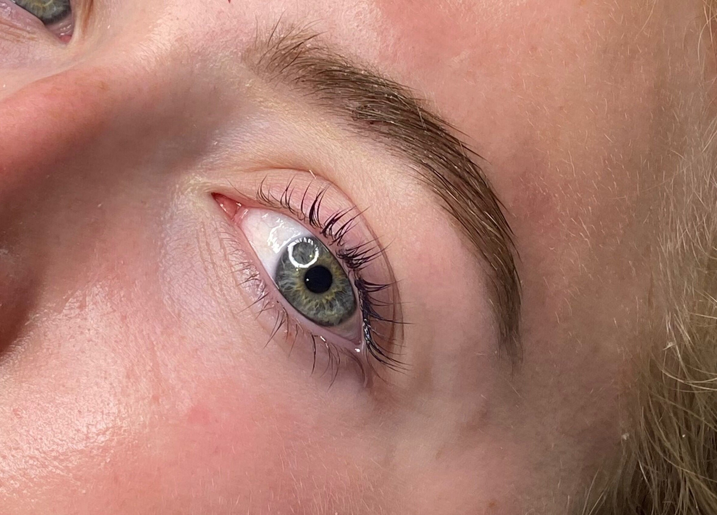 Close-up of manicured eyebrows and lashes at B Studio in Erskine, Western Australia, AU.
