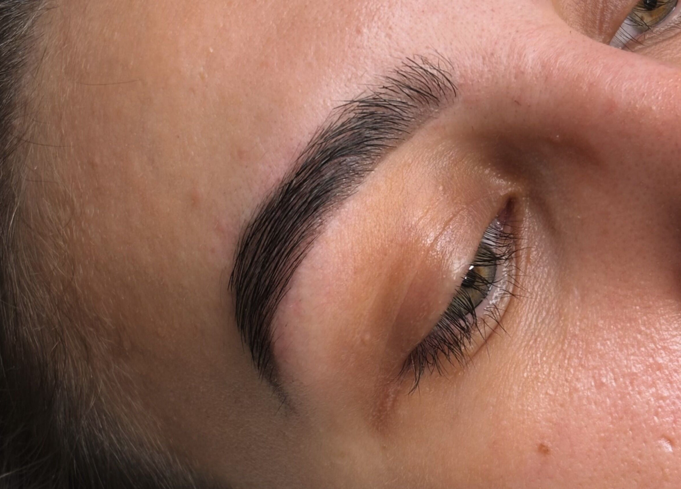 Close-up of perfectly shaped eyebrows at B Studio, Erskine, Western Australia, AU.
