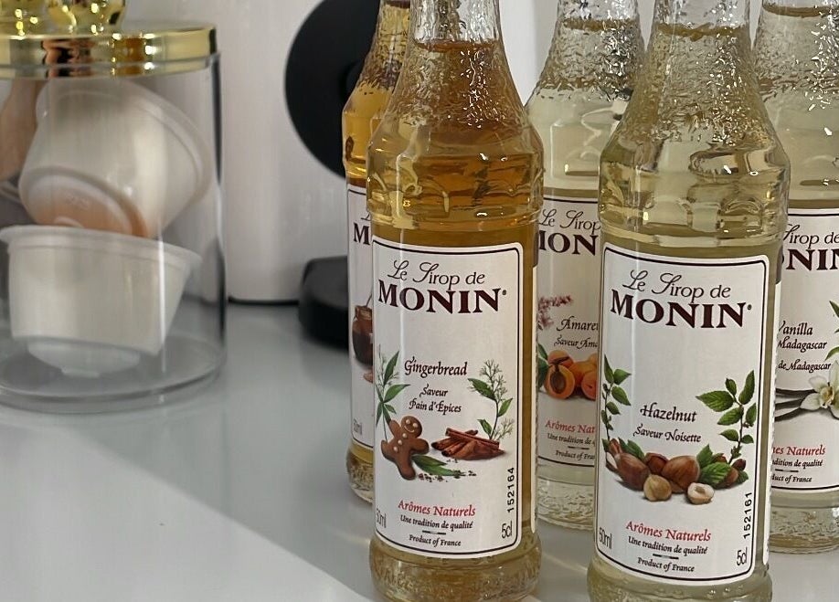 Monin syrup bottles at BeautyGaze in Stansted Mountfitchet, England, GB add a stylish touch to any setting.