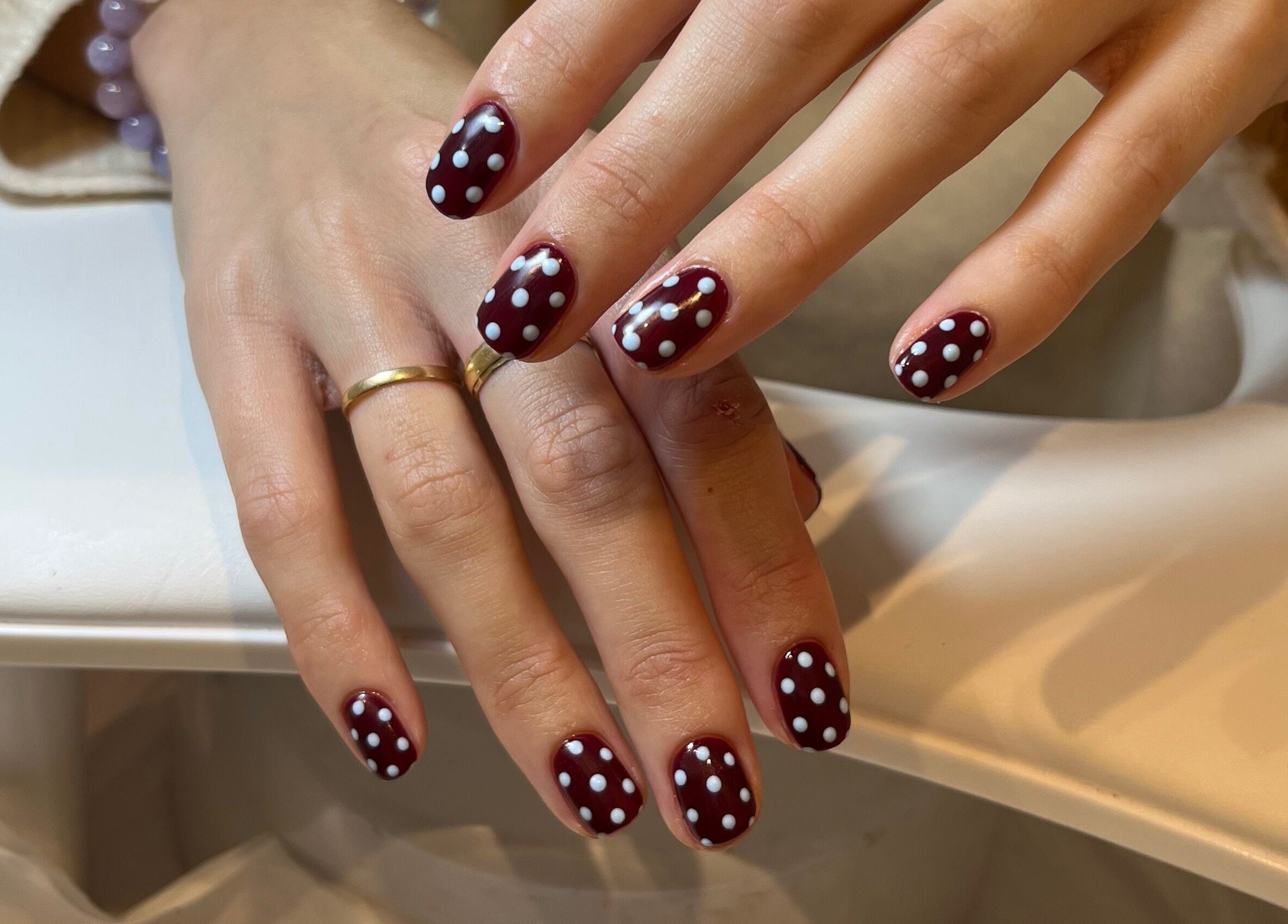 Red polka dot manicure by Emily Francesca - Bristol, showcasing stylish nail art. Located in Bristol, England, GB.