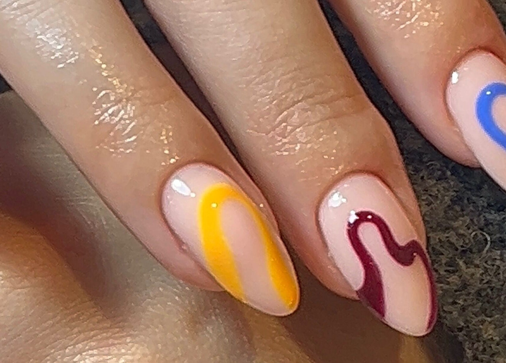 Vibrant nail art with abstract designs by Emily Francesca - Langford, located in Langford, England, GB.