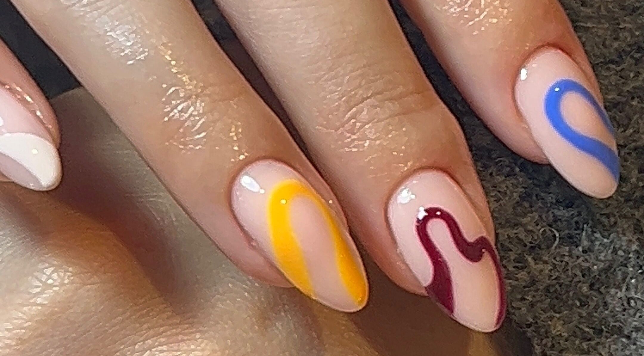 Vibrant nail art with abstract designs by Emily Francesca - Langford, located in Langford, England, GB.