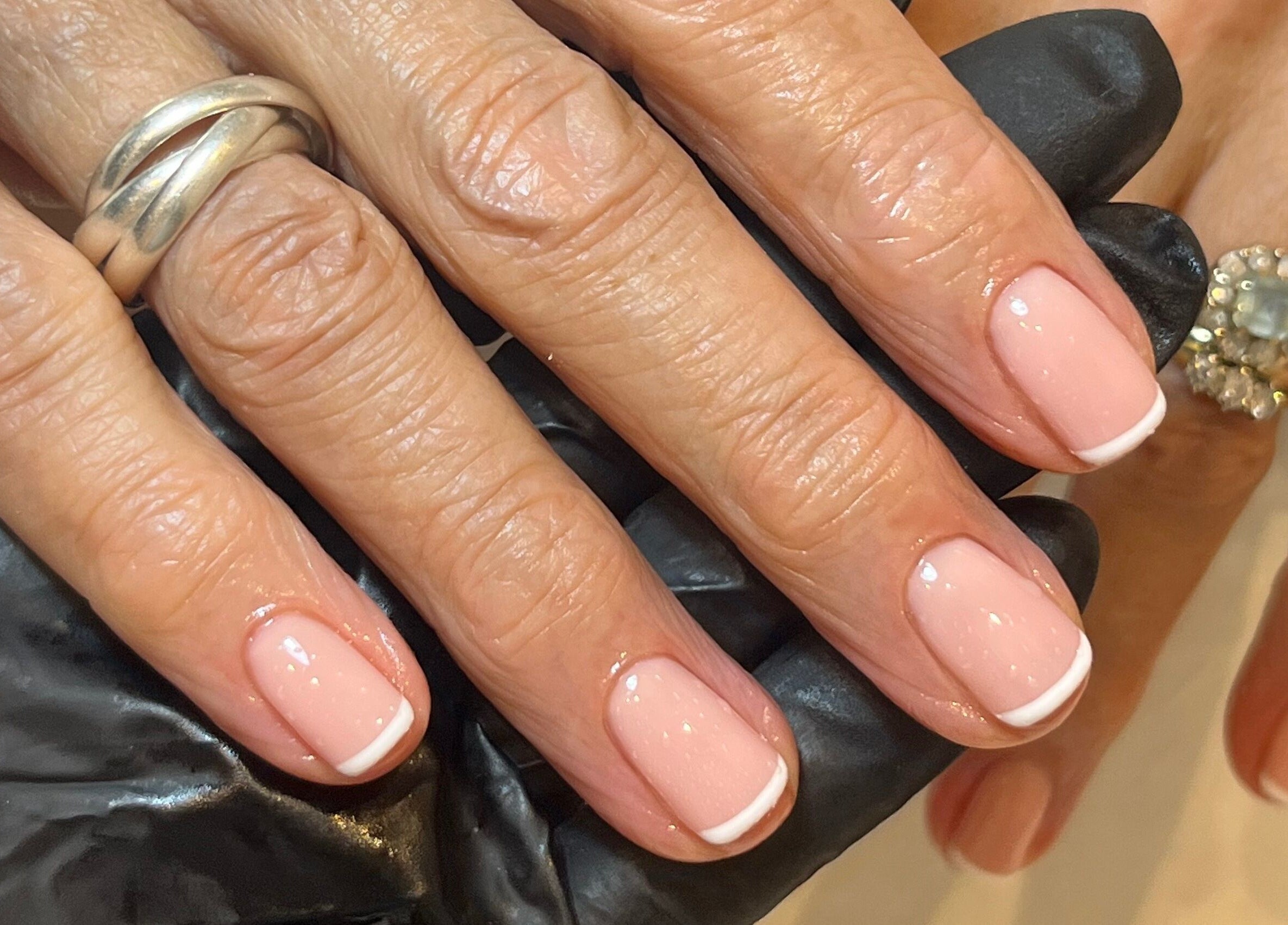 Elegantly manicured nails with French tips at By Emily Francesca - Langford, Langford, England, GB.