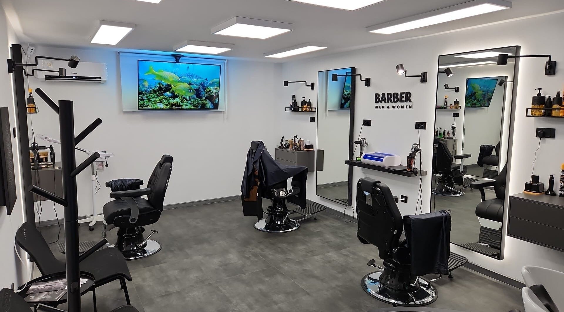 Interior of Barber Men & Women in Novi Sad, RS featuring sleek, modern design with barber chairs and stylish decor.