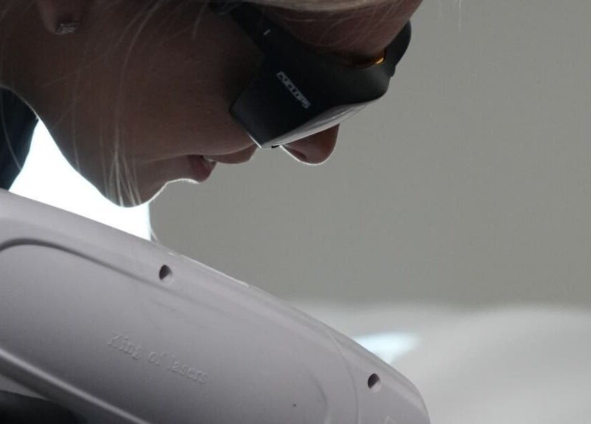 Client receiving laser treatment at Signature Laser in Kintore, Scotland, GB using advanced equipment.