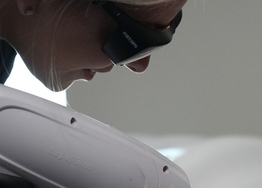 Client receiving laser treatment at Signature Laser in Kintore, Scotland, GB using advanced equipment.