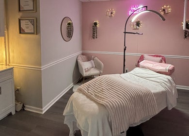Calming treatment room at My Pretty Face Studio, Vero Beach, Florida, US with plush bedding and soft lighting.