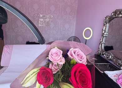 Elegant bouquet at Pretty by Millie, Bewdley, England, GB in a chic pink setting with ornate mirror.
