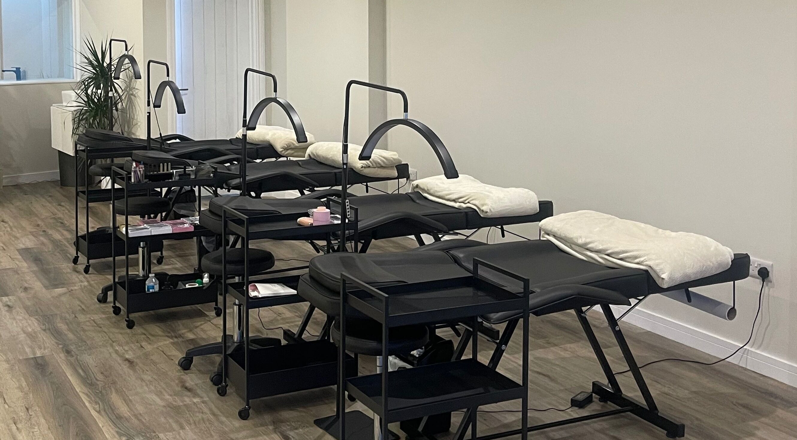 A serene beauty treatment area with modern reclining chairs at Mnk Beauty, Nottingham, England, GB.