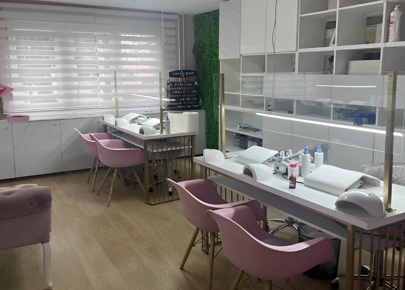 Lovely Line salon's nail area with pink chairs and manicure stations in Sarajevo, Federacija Bosne I Hercegovine, BA.