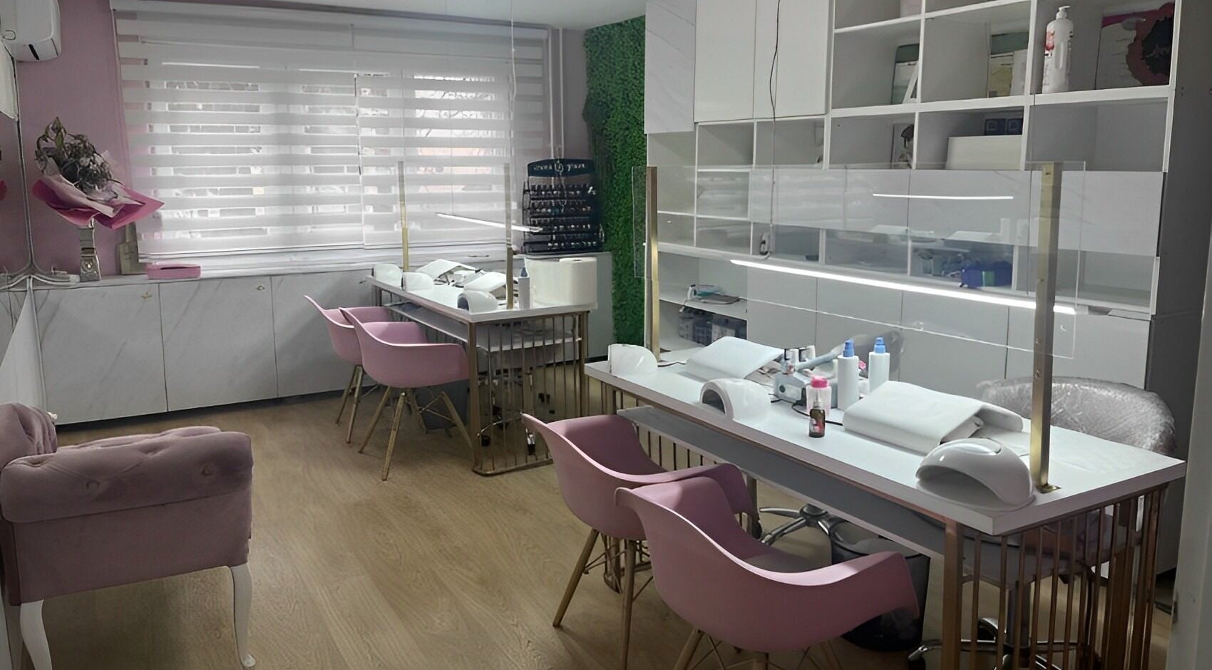 Lovely Line salon's nail area with pink chairs and manicure stations in Sarajevo, Federacija Bosne I Hercegovine, BA.
