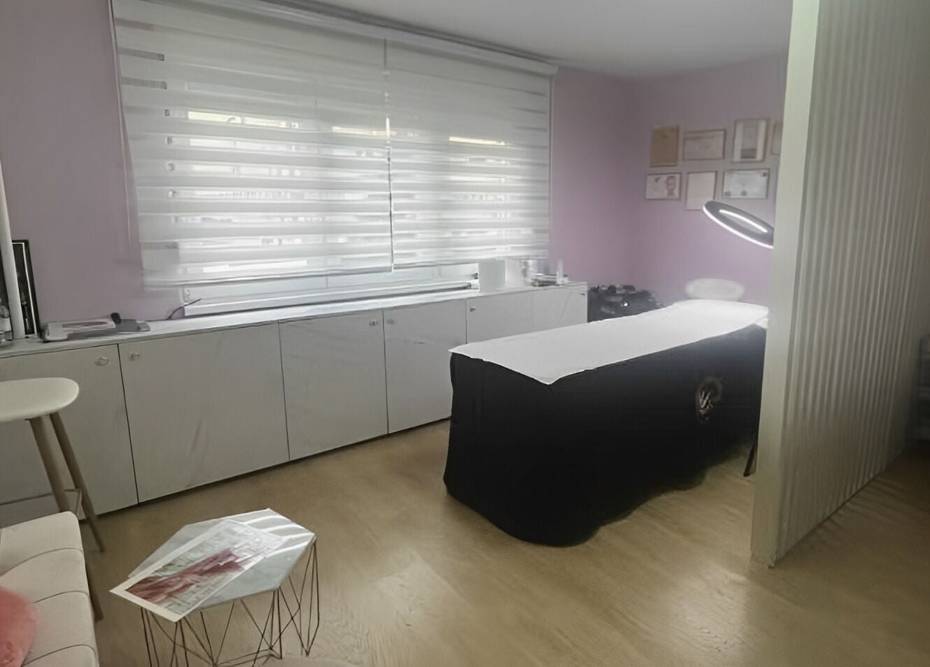 A peaceful treatment room at Lovely Line, Sarajevo, Federacija Bosne I Hercegovine, BA, featuring a massage table.