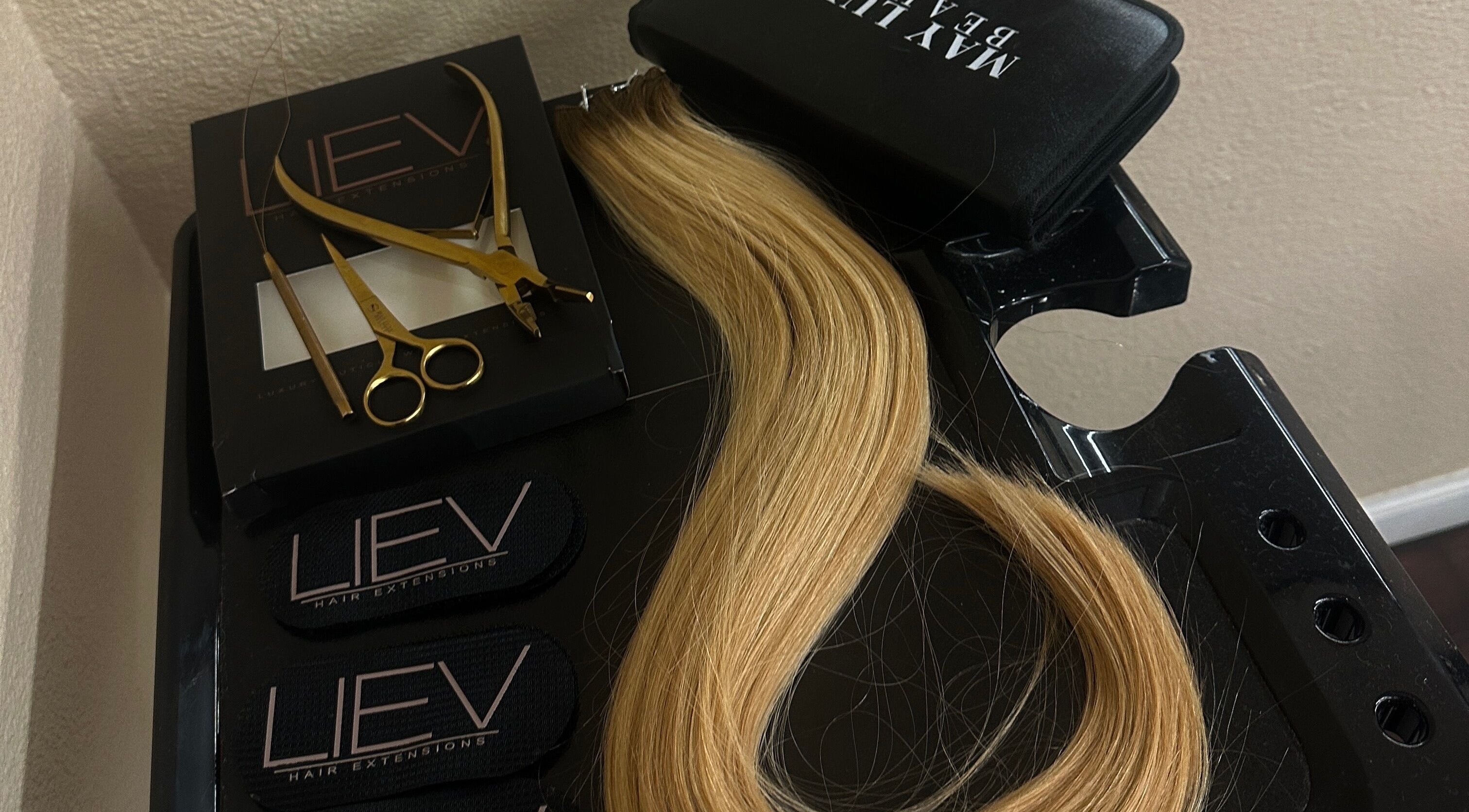Hair extensions and tools at Liev Hair, Tulare, California, US, showcasing premium salon services.
