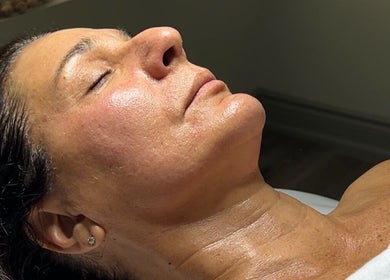 Relaxed woman receiving a facial at Balanced Beauty Med Spa, Vaughan, Ontario, CA.