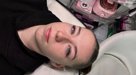 Client receiving beauty treatment at dolledbeautymcr, Manchester, England, GB. A serene facial experience.