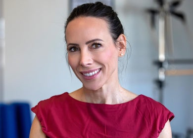 Smiling instructor at Firefly Pilates, Potters Bar, England, GB. Enhancing your wellness journey.