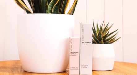 Monuskin skincare beside plants at Sacred Roots Limited, Guernsey, Vale, GG.